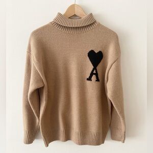 Designer Inspired Tan Sweater with Black Heart Accent